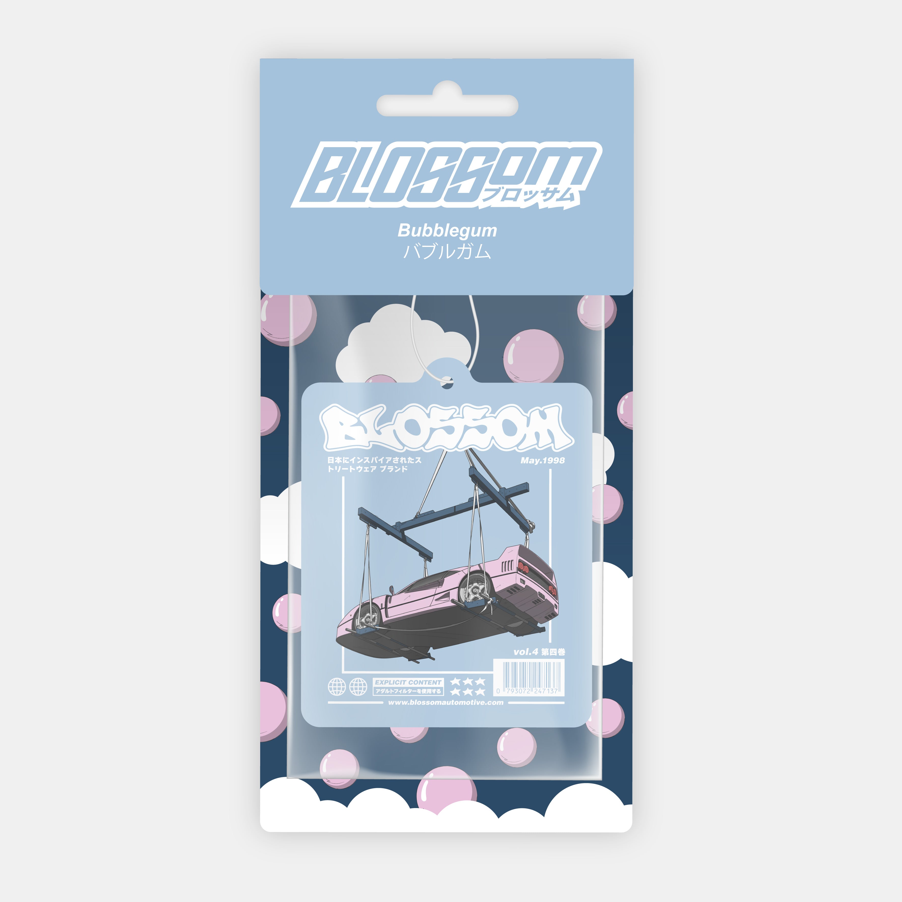 Blossom Automotive’s ‘The Bubblegum Collection’ Air Freshener – Bubblegum features playful bubble and cloud designs, Japanese text, and a pink car on swings beneath blue skies and clouds.