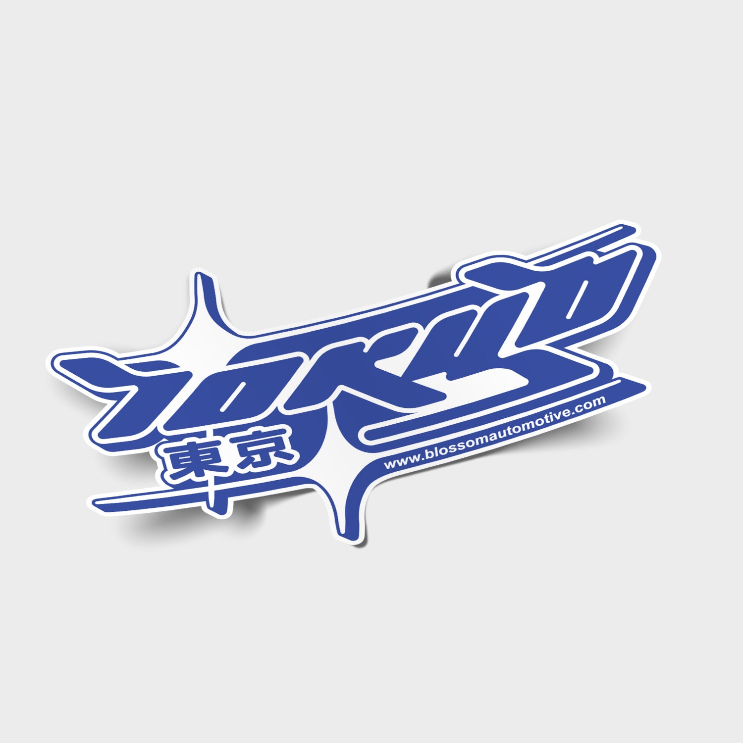 Tokyo Blue - Slap Sticker by Blossom Automotive features stylized blue "TOKYO" text with Japanese characters, dynamic white accents, and www.blossomautomotive.com on a light gray background.