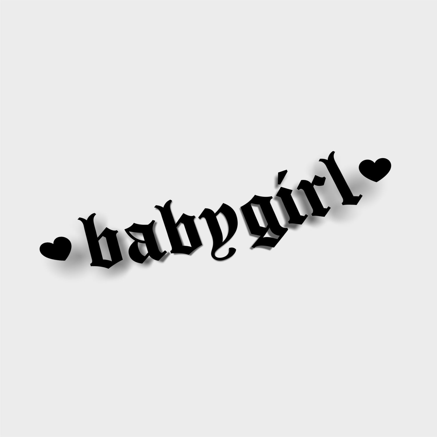 The Babygirl - Die Cut Sticker by Blossom Automotive features "babygirl" in bold, black Old English font with black hearts on each side, all set against a light gray background.