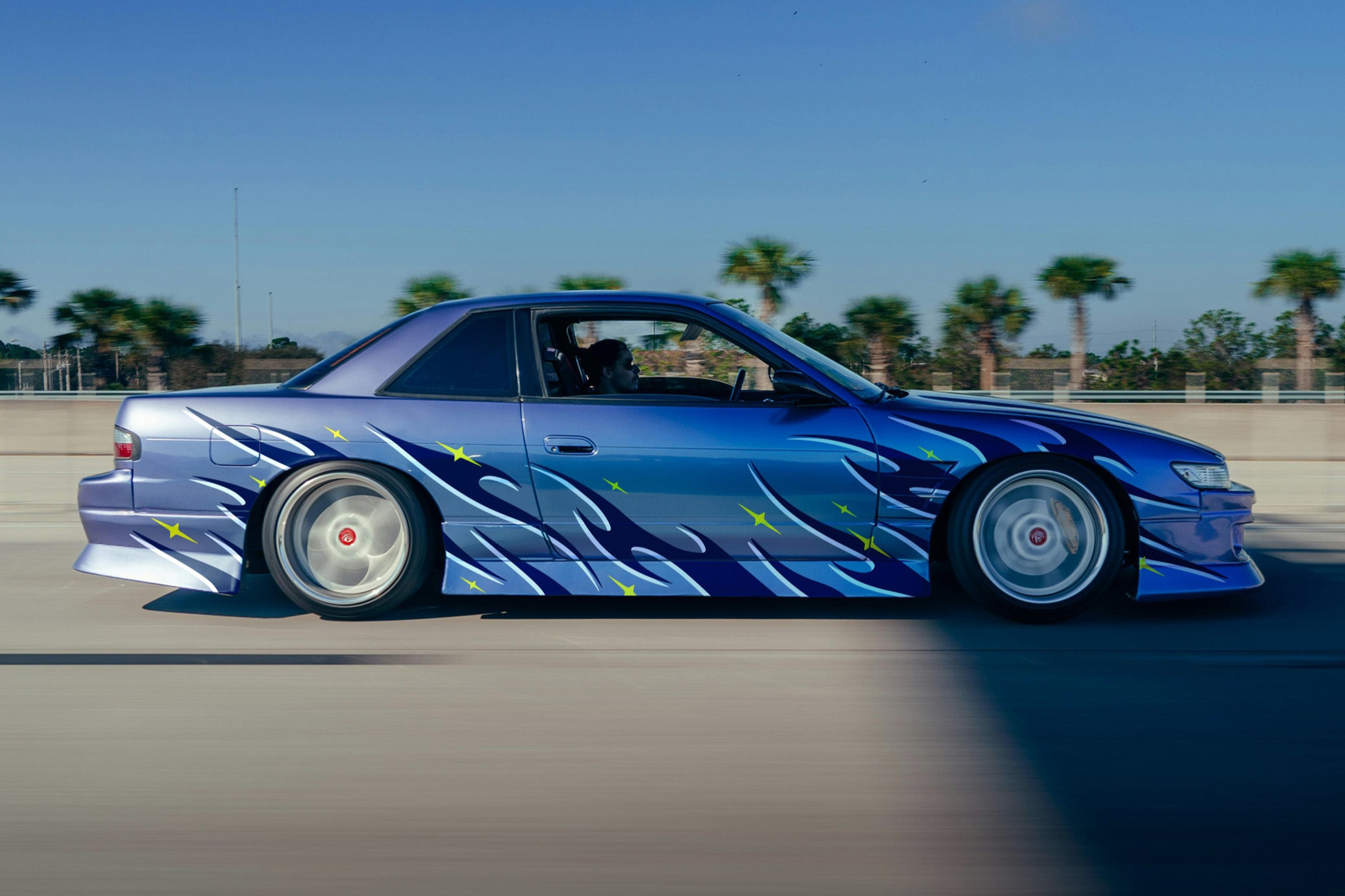 Blossom Automotive Akari livery on purple car