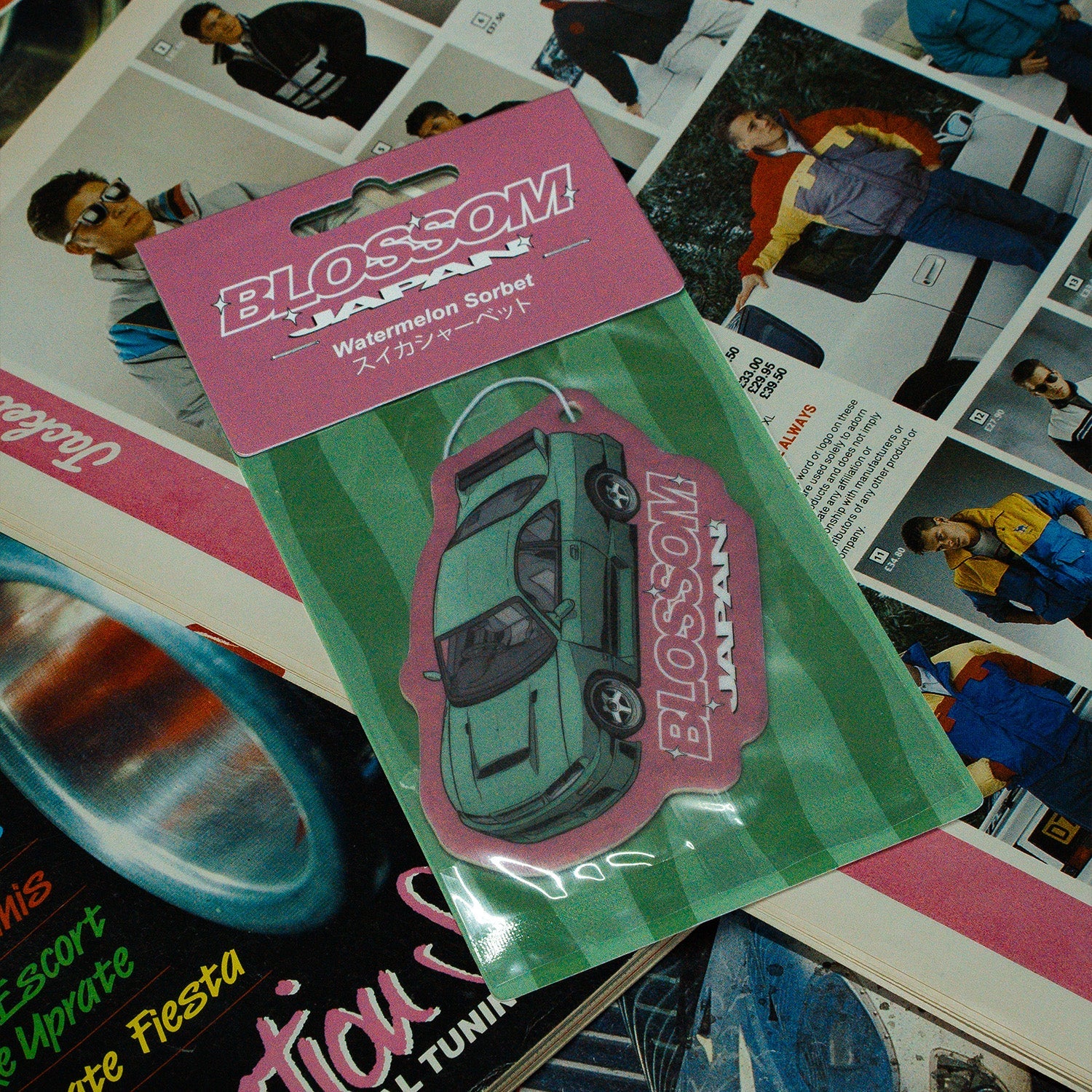 Blossom Automotive zip ties held in front of a red S13 car