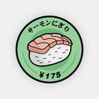 A Blossom Automotive "Nigiri Sushi - Slap Sticker" shows a cartoon-style salmon nigiri on a green plate. Japanese text above reads サーモンにぎり (salmon nigiri), with ¥175 below to indicate the price.