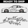 White car with black floral design and cherry blossom branch on a white background, 'Ready to Ship' text at the top.