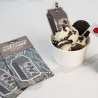 The Blossom Automotive 'The Milkshake Collection' Cookies & Cream Air Freshener is shown beside illustrated sticker packs featuring a Japanese drink carton.