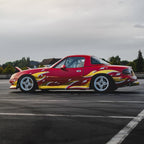 Red and gold sports car with a Blossom Zoku Livery