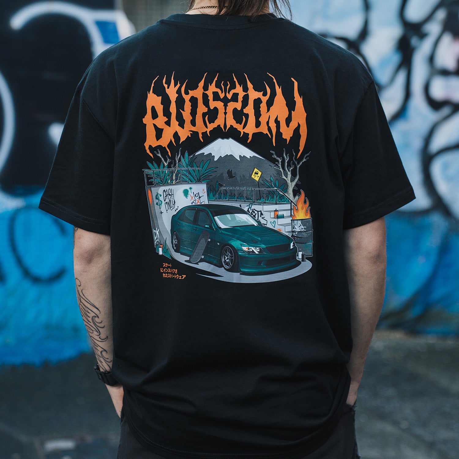 Back print of Blossom Skate Collection black tee, featuring Lexus IS200 graphic, oversized fit, inspired by skate and drift culture