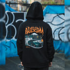 a person wearing the black skate collection hoodie featuring a skatepark and a green Lexus is200