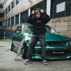 a person sat on a green Lexus is200 wearing the black skate collection hoodie