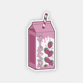 The Blossom Automotive Strawberry Milkshake - Slap Sticker features a pink cartoon-style milk carton with Japanese text, strawberries, and a striped straw on a light gray background.