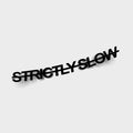 The Strictly Slow - Die Cut Sticker by Blossom Automotive features black 3D text reading "STRICTLY SLOW," tilted and slightly distorted, set on a plain light gray background with subtle shadows beneath each letter.