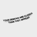 The Blossom Automotive "Your Demons Are Closer Than They Appear" die cut sticker features bold black 3D text on a white background, with faint shadows below that highlight the phrase’s ominous tone.